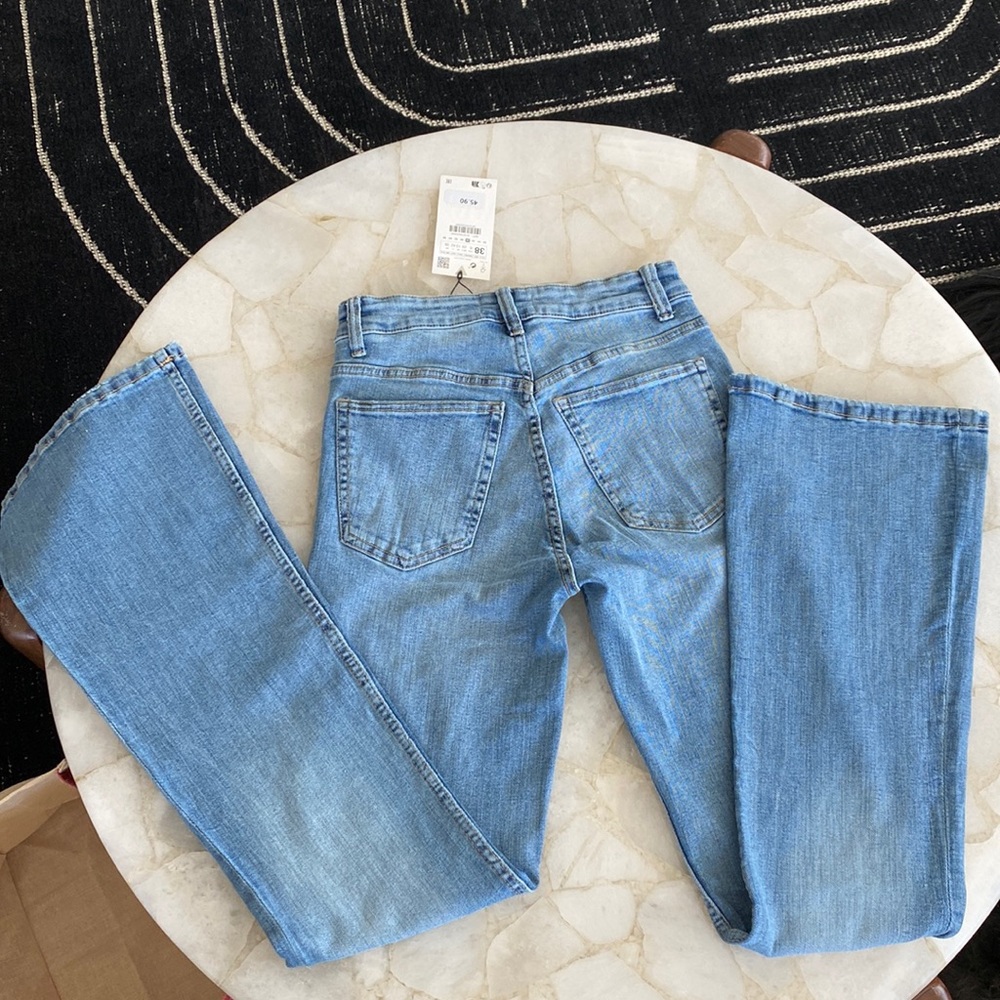 Zara, Flare fit, high rise, flare leg, full length stretch. Light blue wash.